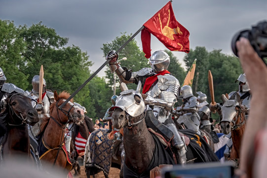 Knightly tournament, historical reenactment (reconstruction) of Middle Ages. Knight on horses and fight.