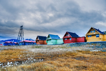 Svalbard cityscape of the Longyearbyen Svalbard building city with riggs and houses on a polar day...