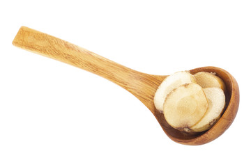 heap of slices of fresh galangal root  in wooden spoon isolated on white background