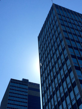 Low angle view of Manchester modern buildings against clear blue sky