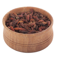 heap of goji berries in wooden cup isolated on white background
