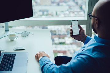 Businessman checking calendar on smartphone