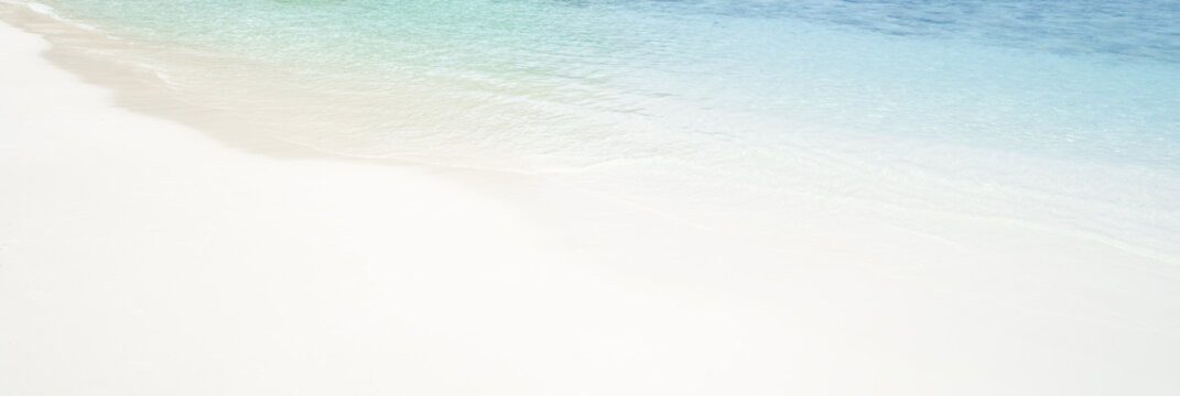 Background white clear sand and transpose sea.  