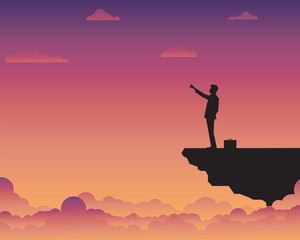 Businessman standing on cliff