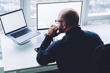 Focused man working on laptop