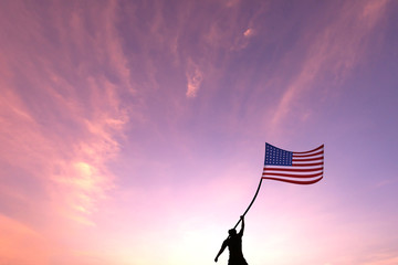 Silhouette man waving USA flag in sunset