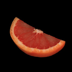 fresh red slice of grapefruit isolated on black background