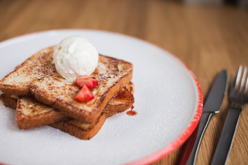 french toasts with an ice-cream and fresh berries 