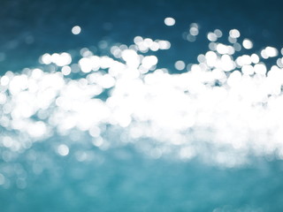 Ripples from the wind in the outdoor swimming pool. Beautiful sun glare on the surface of the...