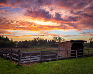 rural landscape at dusk with wooden fence