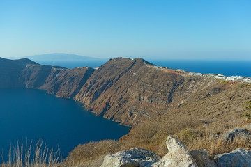 Caldera in Aegean Sea surrounded by gigantic cliffs of Santorini Island, Greece.
