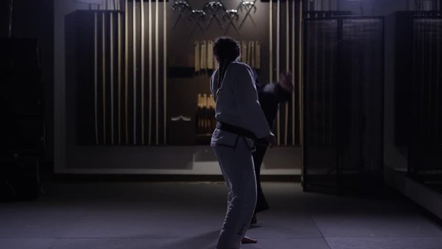 Female fighters training in dojo
