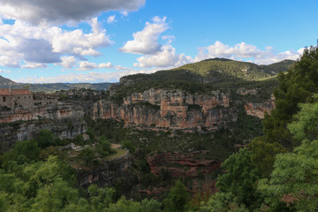 Obraz premium Mountain rocks and clouds