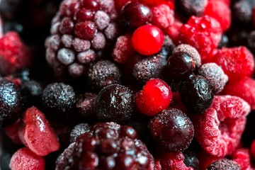 berry fruits close up. frozen blackberry, raspberry, blueberry and currant.