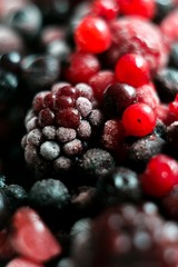 berry fruits close up. frozen blackberry, raspberry, blueberry and currant.