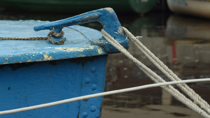 mooring cleat, old boat is moored at the pier