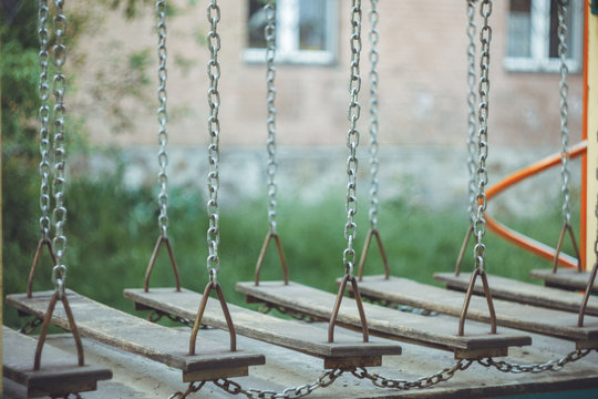 Children's Wobbly Suspension Rope Bridge Close-up On The Playground On A Blurred Background. Copy Space. Leisure