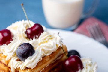 Breakfast, biscuit cake with cherries and milk