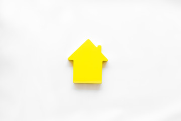 Mortgage credit concept with house toy on white background top view