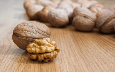Inshell walnuts on a wooden table. Healthy food. Healthy lifestyle.