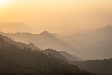 Fototapeta na wymiar Sunrise view of Hill Range with mist in dawn