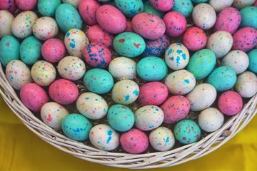 Basket of colorful Easter eggs chocolate candies