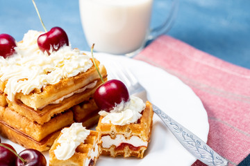 Breakfast, biscuit cake with cherries and milk