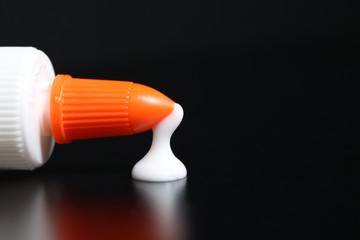 Glue Dripping on black background