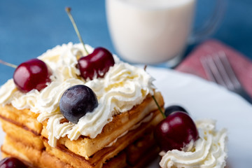 Breakfast, biscuit cake with cherries and milk