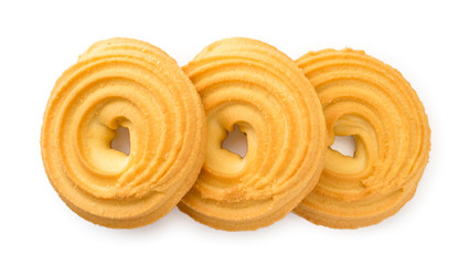 Butter round cookies on a white background. The view of the top.