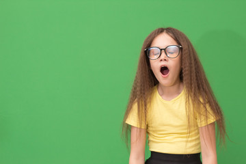 child yawns, the little girl is bored and eager to sleep