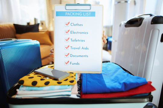 Closeup On Young Traveller Woman Showing Packing List