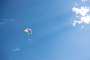 Rainbow kite in the sky. Symbol of tolerance and love.
