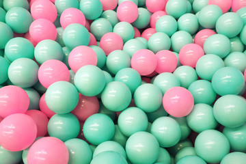 Fototapeta na wymiar Background and texture blue and pink plastic pool balls...