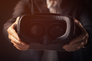 Businesswoman innovator offering VR goggles headset