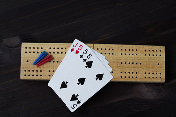 playing cards with cribbage board