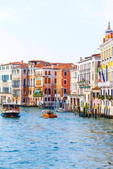 Venice, Italy - July 20 2017 : Gondolier with paddle in Venice. gondolier sail on a Venetian canal during the Carnival of Venice. man in his gondola on the Grand Canal, Italy