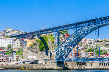 Famous steel bridge dom Luis above connects Old town Porto with Vila Nova de Gaia at river Douro, Portugal.