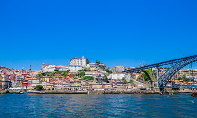 Obraz premium Famous steel bridge dom Luis above connects Old town Porto with Vila Nova de Gaia at river Douro, Portugal.