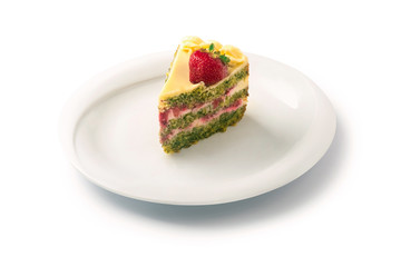 spinach cake with mascarpone cream and strawberry on a plate, isolated on white background
