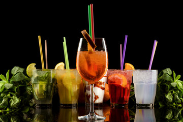refreshing summer cocktails over black background