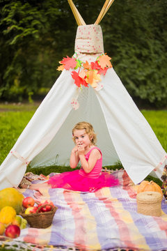 small girl smailling on autumn picnic