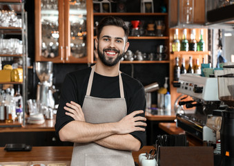 Portrait of smiling barista in coffee shop