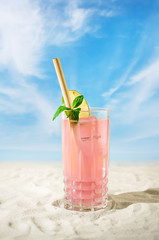 Cold fruit cocktail on the beach