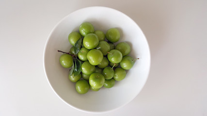 Fresh Green Plum Fruit on Plate