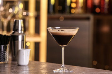 Glass of delicious Espresso Martini on bar counter. Alcohol cocktail
