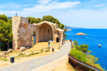 Naklejka premium Ruins of old church in Tossa de Mar town on castle hill, Costa Brava, Spain