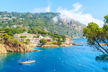Sailing boats on sea in picturesque bay near Fornells village, Costa Brava, Spain