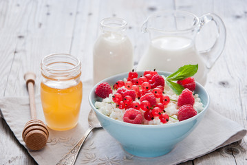 Natural dairy products on a light gray wooden background