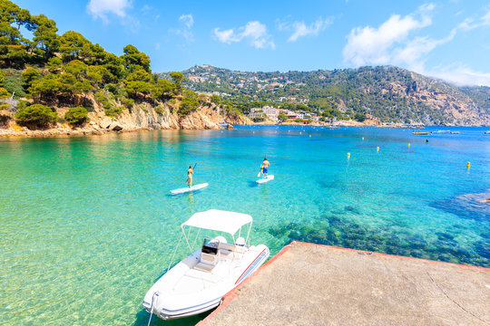 Boat on idyllic beach Aiguablava of near Fornells village, Costa Brava, Spain